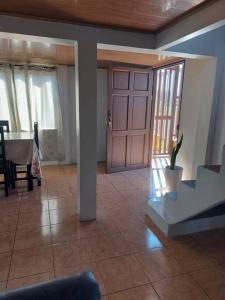 a room with a door and a table with a plant at Alojamiento Casmar cerca de playas in Palma