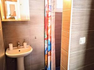 a bathroom with a sink and a mirror at Blue Moon Apartments in Nea Michaniona +72 photos