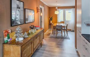 a living room with a table with a christmas tree on it at Lovely Apartment In Rjukan in Rjukan