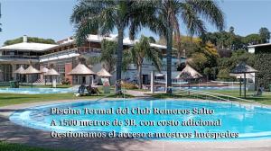 a sign for a resort with a swimming pool at 3B Habitación SUR con baño privado y AC in Salto