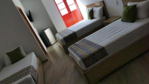 Letto o letti in una camera di ALTO VERDE HOTEL