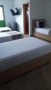 Letto o letti in una camera di ALTO VERDE HOTEL