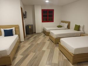 Letto o letti in una camera di ALTO VERDE HOTEL