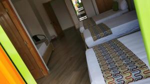 Letto o letti in una camera di ALTO VERDE HOTEL
