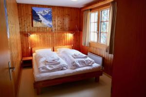 Ένα ή περισσότερα κρεβάτια σε δωμάτιο στο Chalet Lieke Parterre