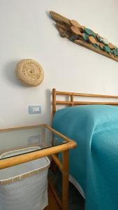 A bed or beds in a room at Sunrise B&B Le castella