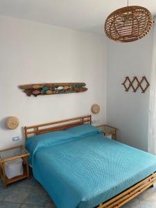 A bed or beds in a room at Sunrise B&B Le castella