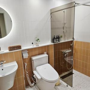 a bathroom with a toilet and a sink at Exclusive House Hanok Stay 'Soo Hanok' in Suncheon