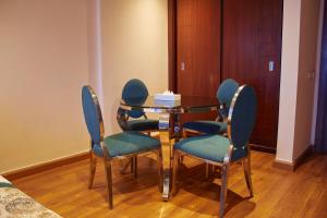 a dining room with a glass table and chairs at Tolip Hotel Alexandria in Alexandria