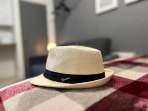 a straw hat sitting on top of a table at Cosy Studio near the City Centre in Liverpool