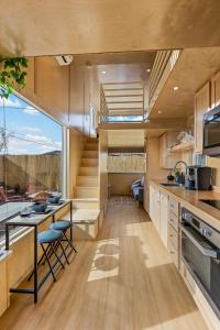 a kitchen with a large window and a staircase at Tiny home near Grand Canyon sleeps 5, epic views! in Flagstaff