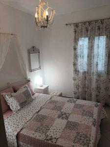 Postel nebo postele na pokoji v ubytování Lina's House Sivota