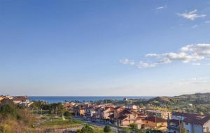 a city with houses and the ocean in the background at Beautiful Apartment In Badolato Marina in Badolato