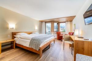 Voodi või voodid majutusasutuse Hotel Allalin Saas-Fee toas