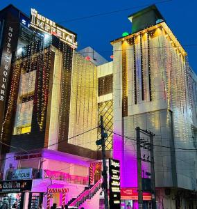 a group of buildings in a city at night at HOTEL IMPERIAL in Aurangābād