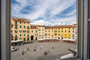 a view from a window of a square with buildings at Casa Pino 2 bedrooms 2 bathrooms contemporary apar in Lucca