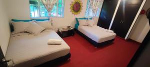 Katil atau katil-katil dalam bilik di Casa Bosco Minca