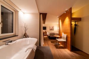 Vannituba majutusasutuses Hotel Allalin Saas-Fee