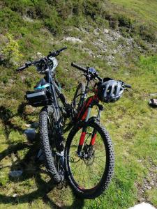 a bike is parked on a grassy hill at Gästehaus Christoph in Ried im Zillertal