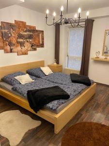 a bedroom with a large bed with pillows on it at Köln Apartment I in Cologne
