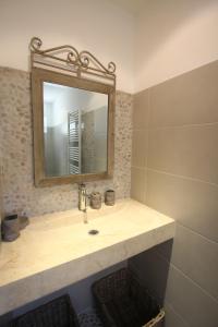 a bathroom with a sink and a mirror at maison 180 m² proche de Beaumes de Venise in La Roque-Alric