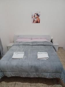 Posteľ alebo postele v izbe v ubytovaní B&B Appartamenti NAPOLI