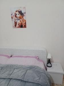 Posteľ alebo postele v izbe v ubytovaní B&B Appartamenti NAPOLI