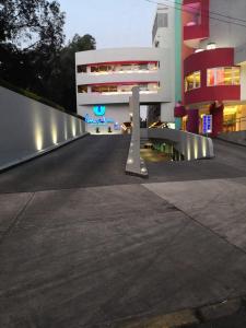 an empty street in front of a building at Hotel Amala in Mexico City