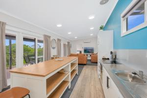 a kitchen with a sink and a counter top at Horizon Holiday Apartments in Narooma
