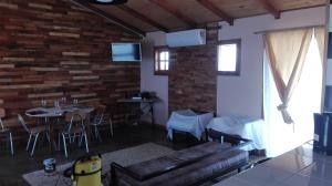 a living room with a couch and a table at Cabañas Madera del Confin Angol in Angol