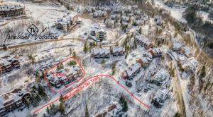an aerial view of a ski resort in the snow at L'Algonquin by Tremblant Vacations in Mont-Tremblant