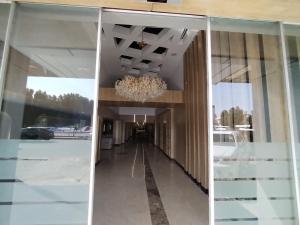 a hallway in a building with a chandelier at سما ستار للشهري والسنوي in Jeddah