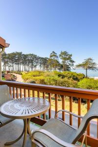 a balcony with a table and chairs and the ocean at Spectacular Ocean View - 3 Heated Pools - Seascape in Aptos