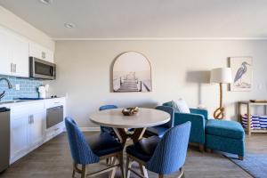 a kitchen and living room with a table and chairs at Spectacular Ocean View - 3 Heated Pools - Seascape in Aptos