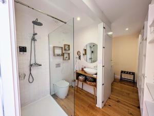 a bathroom with a shower and a toilet and a sink at Look At Me - Serviced Lofts & Studios in Porto +51 photos
