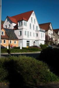 a large white house with a red roof at Wohnwerk41 in Schwäbisch Hall