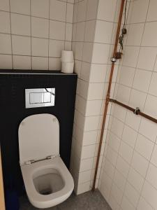 a small bathroom with a toilet in a stall at Hospoda U Máně in Řepiště