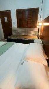 Postel nebo postele na pokoji v ubytování Pousada Lagoa do Rosa