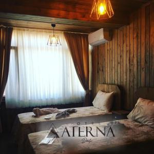Postel nebo postele na pokoji v ubytování ATERNA HOTEL