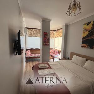 Postel nebo postele na pokoji v ubytování ATERNA HOTEL + 17 fotografií