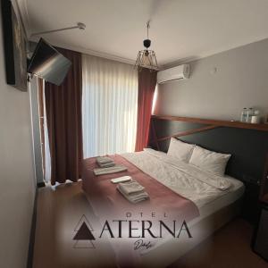 Postel nebo postele na pokoji v ubytování ATERNA HOTEL