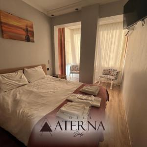 Postel nebo postele na pokoji v ubytování ATERNA HOTEL