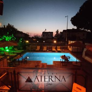 a swimming pool at night with the sky at ATERNA HOTEL in Dikili