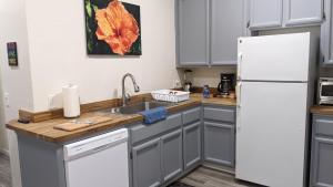 a kitchen with a white refrigerator and a sink at Chili Bar Casita in Placerville