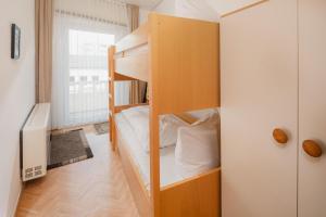 a small room with bunk beds in it at Haus Tiemann Wohnung 7 in Norderney