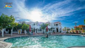 a swimming pool in front of a house at La Hacienda San Felipe Rental Condo 2 in San Felipe