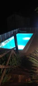 a swimming pool at night with a blue at B&B Marconi in Montefalcone Appennino