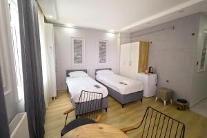 Postel nebo postele na pokoji v ubytování JOE BLACK APART