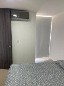 Ein Bett oder Betten in einem Zimmer der Unterkunft Comodo Apartamento Cartagena