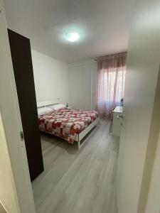 A bed or beds in a room at La Terrazza Apartment